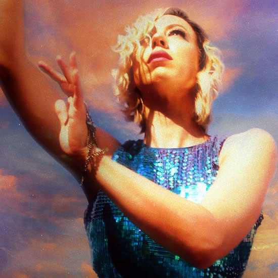 Portrait of Whitney Tai, winner of InterContinental Music Awards 2021, posing for their award