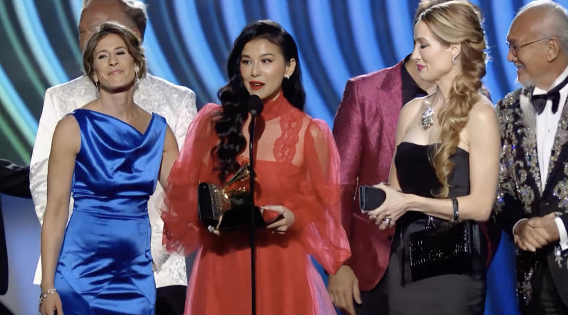 Sangeeta Kaur holding Grammy award and giving speech at the 64th Grammy event