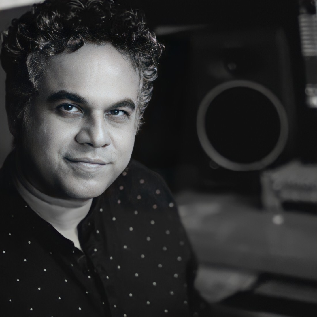 Portrait of Aashish Rego, winner of InterContinental Music Awards 2022, posing for their award