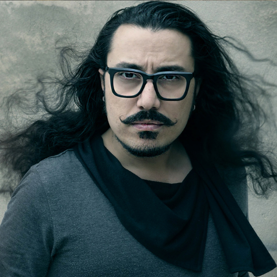 Portrait of Farid Hamedi, winner of InterContinental Music Awards 2022, posing for their award