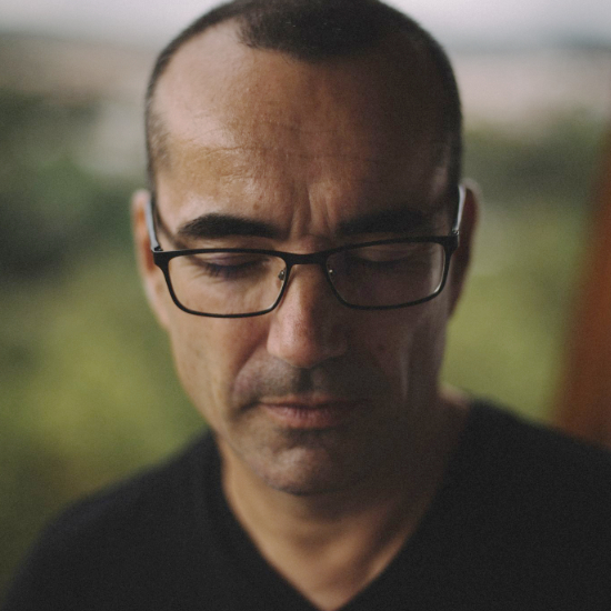 Portrait of Juan Sánchez, winner of InterContinental Music Awards 2022, posing for their award