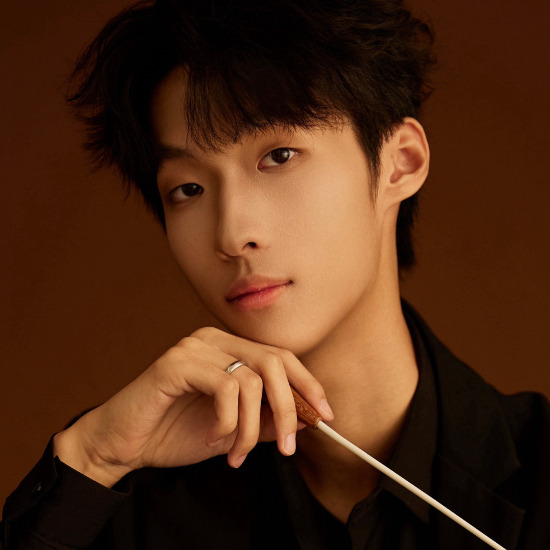 Portrait of Zhuoyuan Li, winner of InterContinental Music Awards 2024, posing for their award