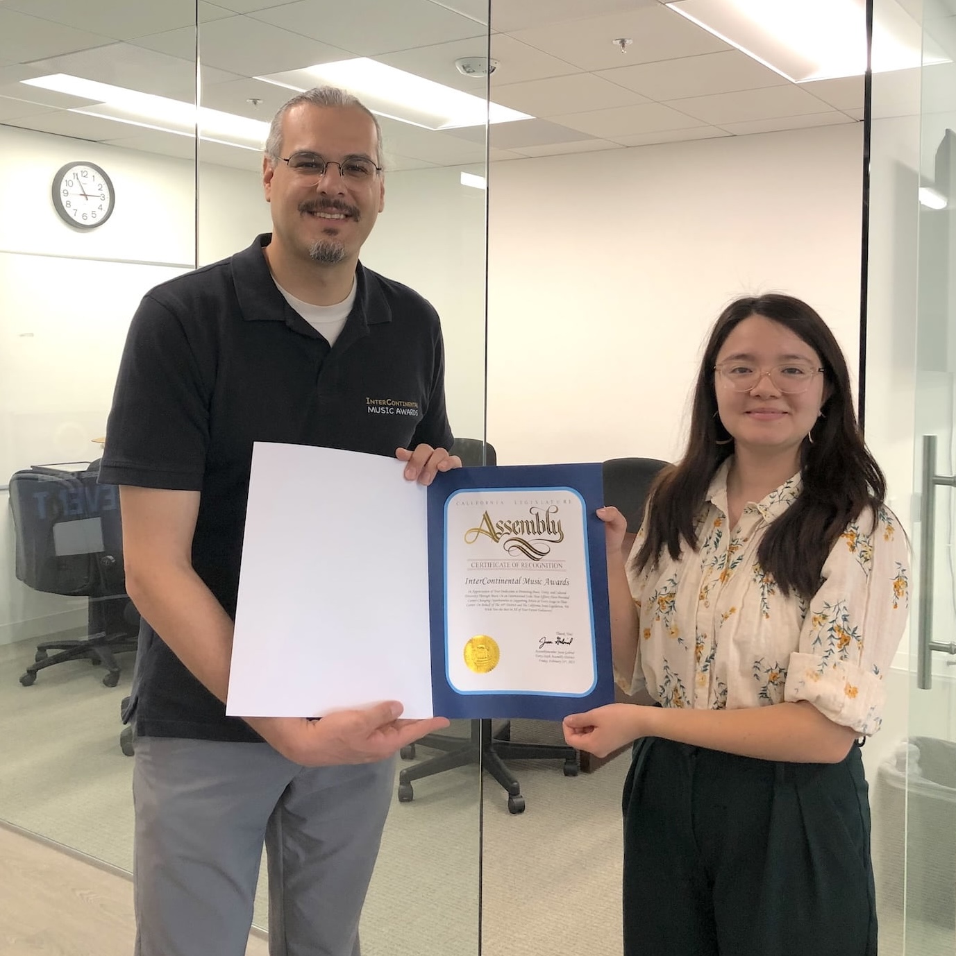Clarissa Gomez, field representative from Assemblymember Gabriel’s office, presenting the Certificate of Recognition to Shahed Mohseni Zonoozi, founder and director of InterContinental Music Awards, at Jesse Gabriel's office